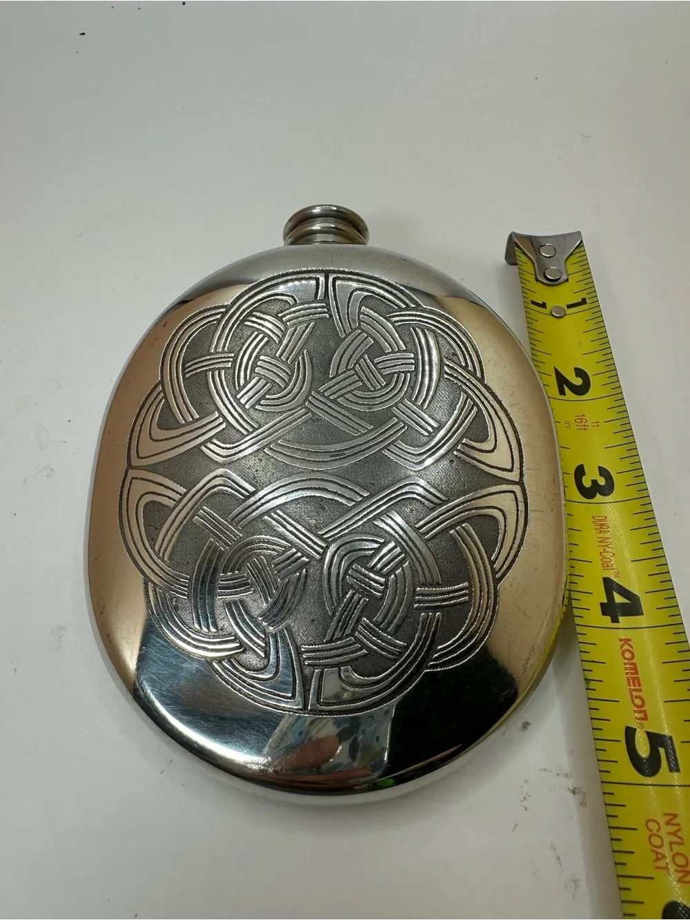 Scottish Piper Pewter Flask with Celtic Knot Design.